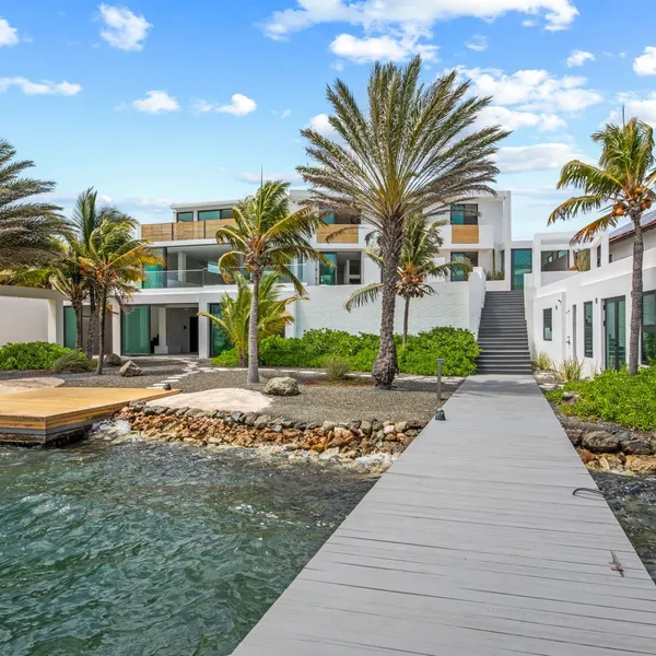 Waterfront villa viewed from the jetty — Jan Sofat 175, Curaçao.