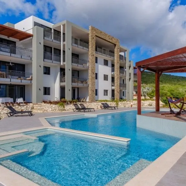 Apartment building with pool and sun terrace — Cape Marie Luxury Apartments, Curaçao.