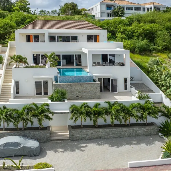 Aerial view of the villa facade and pool — Blue Bay 77-BP, Curaçao.